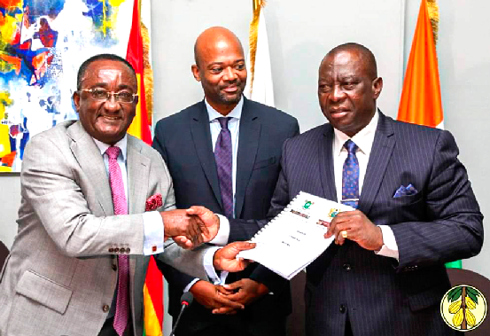  Dr Owusu Afriyie Akoto (left) Ghana’s Minister of Food and Agriculture, handing over the chairmanship documents to Kobenan Kouassi Adjoumani (right), while Alex Assanvo Executive Secretary of CIGCI looks on
